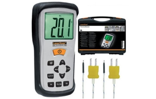 Technician checking a contact temperature measuring instrument during inspection