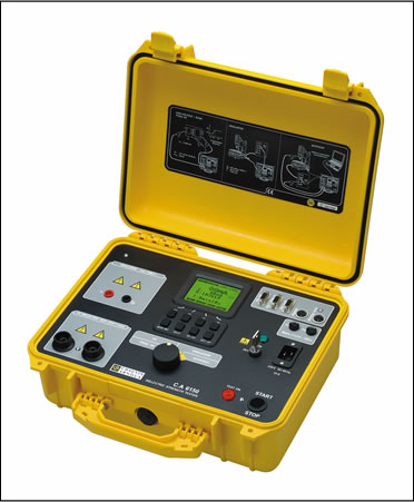 Technician checking an electrical insulation tester during inspection service
