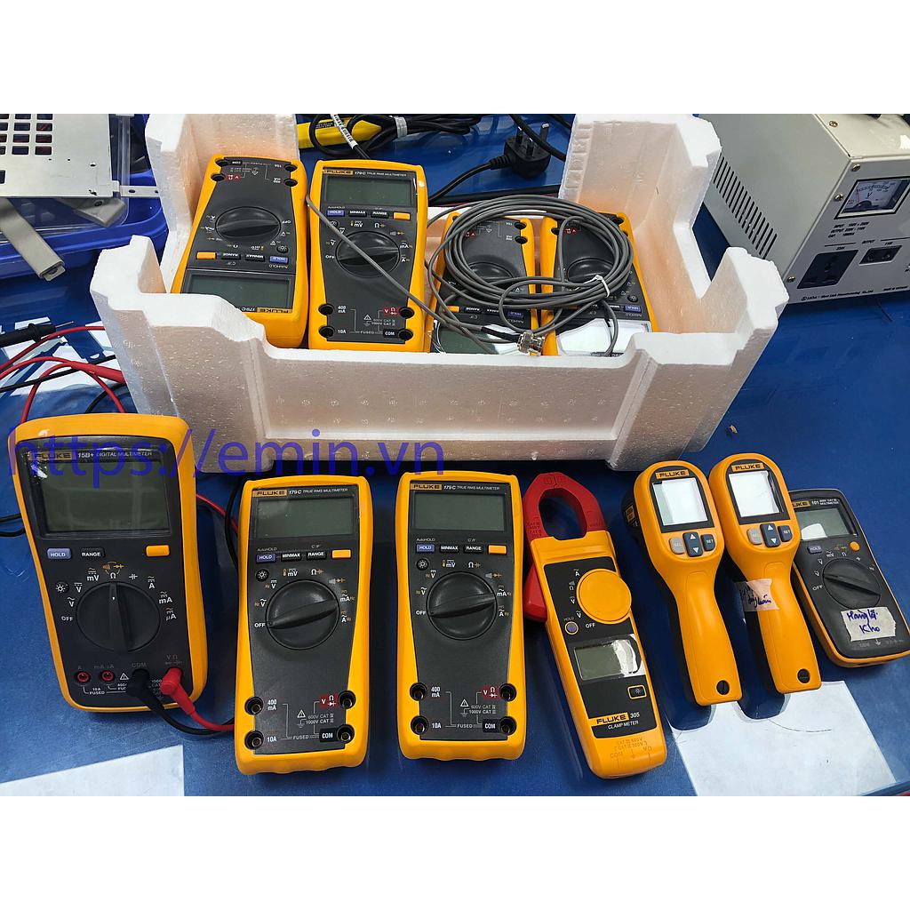 Technician handling multimeter repair and inspection equipment